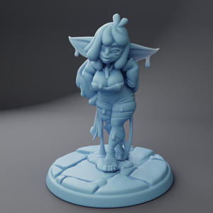 a blue figurine is standing on a piece of ice