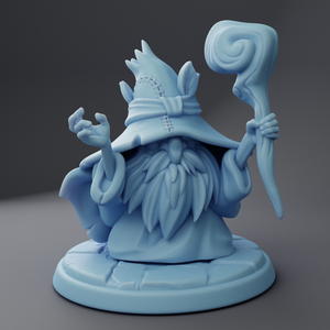 a blue figurine of a wizard holding a staff