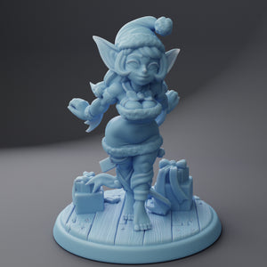 a blue figurine of an elf on a table