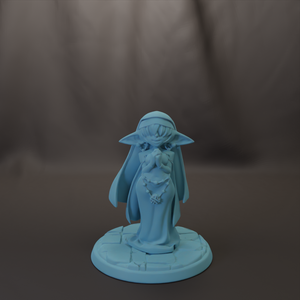 A light blue figurine of a person wearing a hat and holding a book stands on a circular base against a dark background.