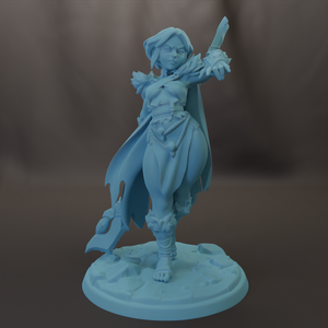 A figurine of a female character with a flowing cape and holding a weapon, standing on a base.