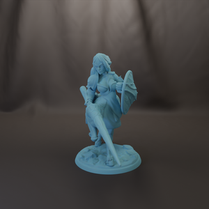 A figurine of a woman holding a shield and sword, standing on a base.