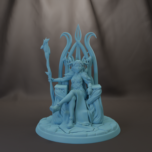 A figurine of a woman sitting on a throne, holding a staff and wearing a flowing dress.