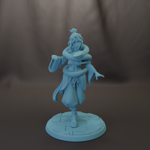 A figurine of a person with long hair and a headdress, standing on a stone base and holding a snake.