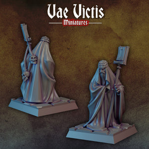 two miniature figures of a man with a skull on his shoulder, standing on a pedestal.