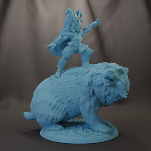 A blue figurine of a person riding on top of a bear.
