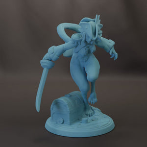 A blue figurine of a fantastical creature, possibly a dragon or serpent, standing on a base with a chest and holding a sword.