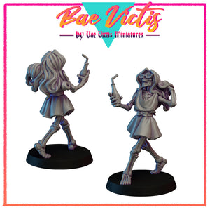 a couple of figurines of a girl and a skeleton