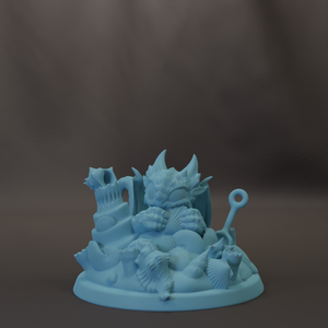 A blue dragon figurine is sitting on a pile of seashells and other objects, creating a whimsical and imaginative scene.