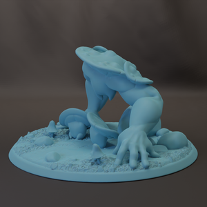 A light blue, abstract sculpture resembling a creature or monster, with a large head and extended arms, set against a dark background.