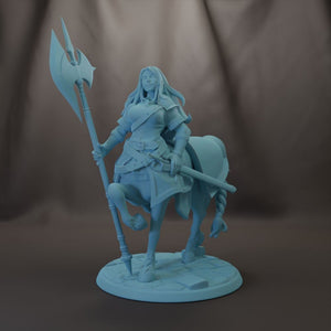 A figurine of a woman standing on a horse, holding a spear and sword.