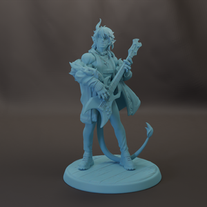 A figurine of a person playing a guitar, standing on a platform.