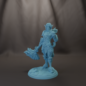 A figurine of a warrior standing in a fighting stance, holding a weapon and wearing armor.