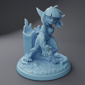 a blue figurine of a dragon sitting on top of a table