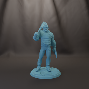 A figurine of a person holding a weapon and standing in a dark environment.