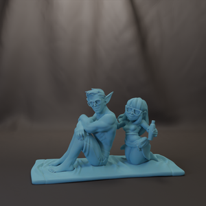 A figurine of a man and a woman sitting together on a surface, both wearing glasses.