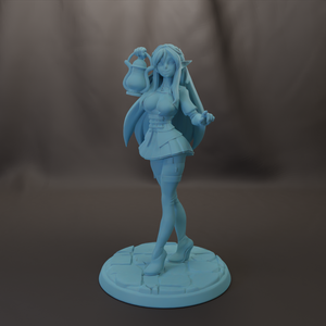 A figurine of a woman with long hair and a flowing skirt, holding a lantern in her hand, standing on a stone base.