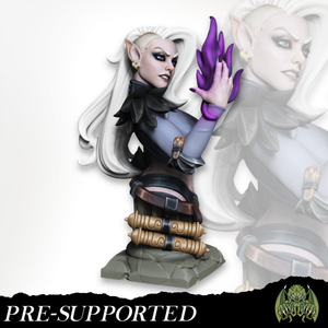 A figurine of a woman with blonde hair and a purple flame in her hand, wearing a black outfit and standing on a rock.