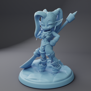 a plastic figurine of an alien with a sword