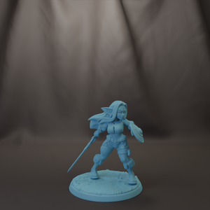 A figurine of a female character with long hair and a sword, standing on a base.