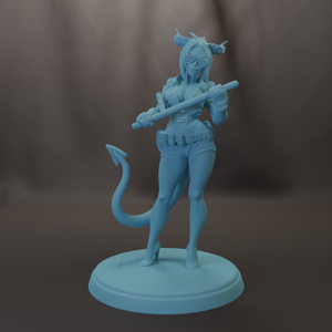 A figurine of a woman with horns, wearing a helmet and holding a weapon, standing on a pedestal.
