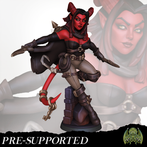 A figurine of a female character with horns and a red face, wearing a black outfit and holding a weapon.