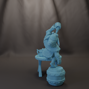 A light blue figurine of a person sitting on a barrel, holding a cup in their hand.