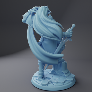 a blue statue of a wizard holding a staff
