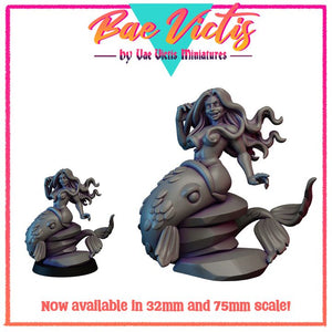 a mermaid figurine sitting on a fish, with the mermaid's hair blowing in the wind. The mermaid is depicted in a 3D model, and the image is available in 32mm and 75mm scale.
