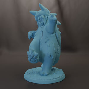 A light blue figurine of a person wearing a hat and holding a weapon, standing on a base.