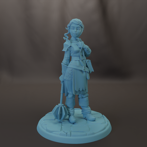 A figurine of a female character with a sword and shield, standing on a stone base.