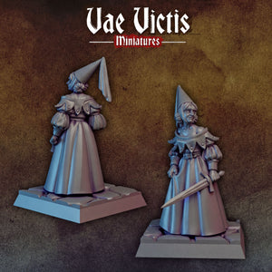 two figurines of women dressed in medieval-style clothing, standing on platforms and holding weapons.