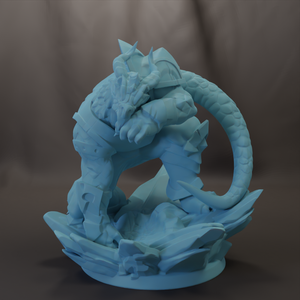 A 3D rendering of a blue dragon-like creature with sharp teeth and claws, standing on a rocky surface.