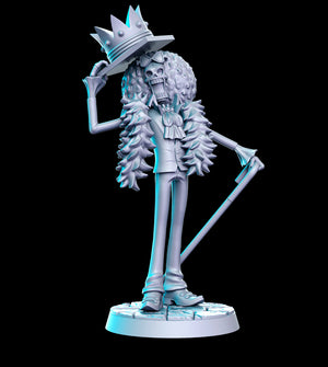 a statue of a skeleton with a top hat and cane