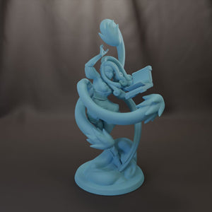 A light blue figurine of a woman with long hair and a flowing skirt, holding a small object in her hand, is depicted in a dynamic pose.