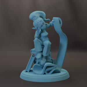 A light blue figurine of a person sitting on a chair, holding a book in their hand.