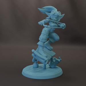 A light blue figurine of a character with a large head, wearing goggles and holding a weapon, standing on a platform.
