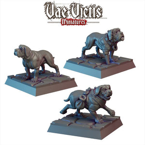three miniature figurines of dogs, each on a platform. The dogs appear to be of a similar breed and are depicted in various poses, such as standing, running, and crouching. The image does not contain any text or additional objects, and the focus is solely on the three dog figurines.