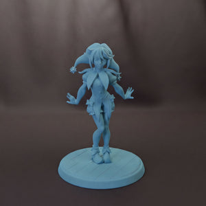 A figurine of a jester-like character standing on a platform.