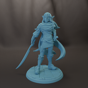 A figurine of a female character with long hair and a flowing cape, holding a sword and standing on a stone base.