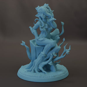 A blue, 3D-rendered statue depicting a fantastical, winged creature sitting on a tree stump.