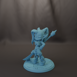 A figurine of a female character with a pointed weapon, standing on a base.