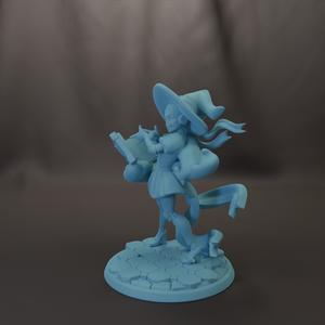 A blue figurine of a witch holding a book and standing on a platform.