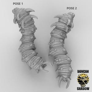 two 3D models of a creature with a long, coiled body and sharp teeth, resembling a snake or a similar type of animal.