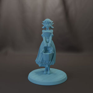 A light blue figurine of a young girl with a basket stands on a circular base against a dark background.