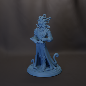 A figurine of a character with tentacles, holding a book and standing on a base.