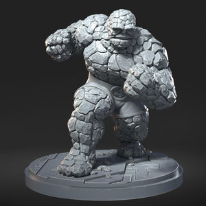 A 3D rendering of a muscular, stone-like figure with a determined expression, standing on a platform.