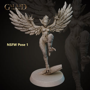 a statue of an angel with wings on a black background