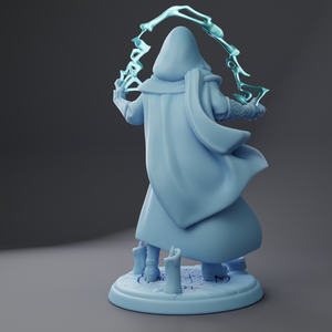 a blue statue of a wizard holding a wand