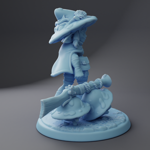 a blue figurine with a hat on top of it